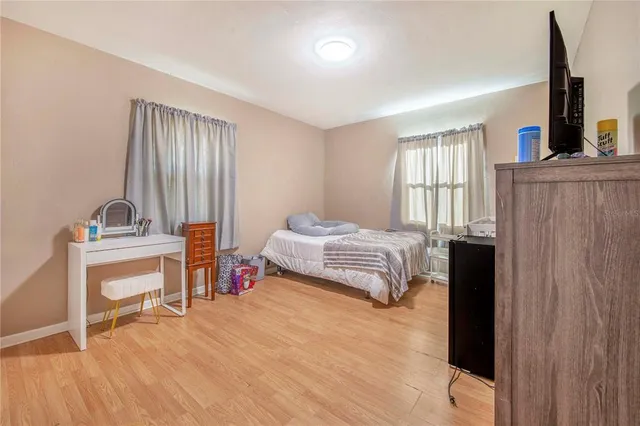 a bedroom with a bed and a chair