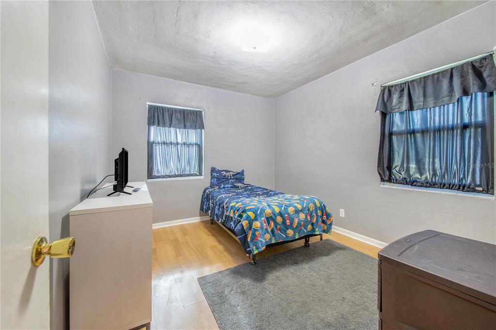 308 Granada Road Auburndale, FL 33823 - Photo 15 of 37 a bedroom with a bed and a window