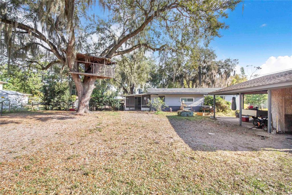 308 Granada Road Auburndale, FL 33823 - Photo 31 of 37 a view of a house with a patio