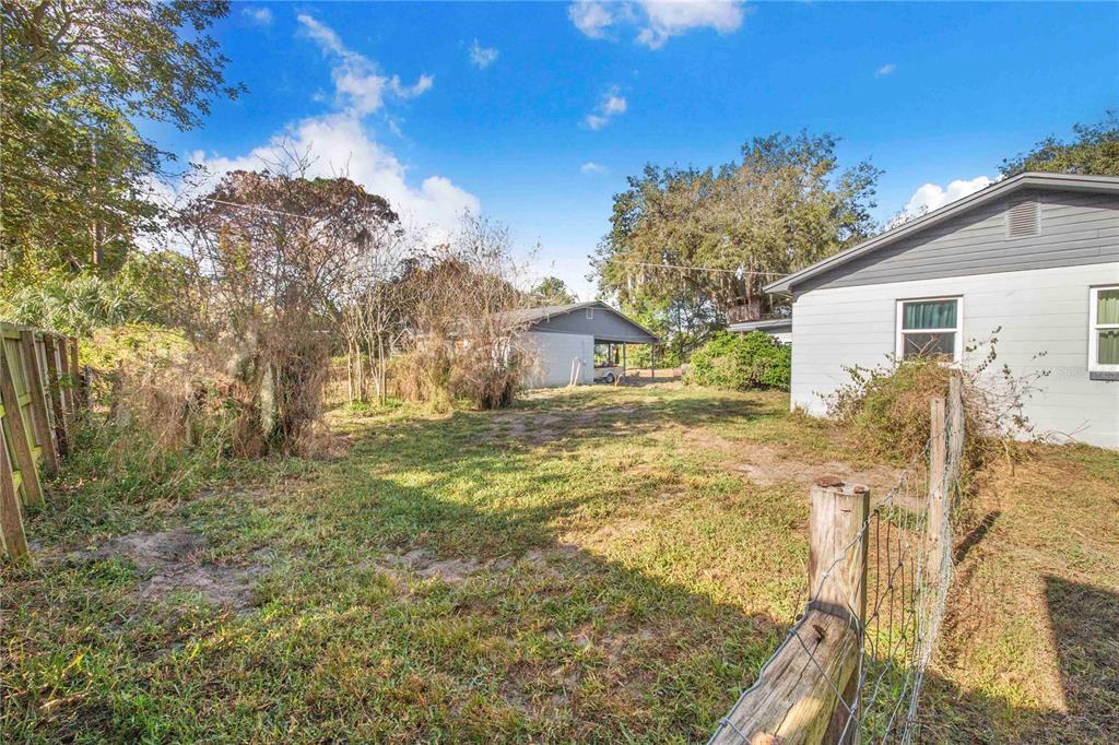 308 Granada Road Auburndale, FL 33823 - Photo 36 of 37 a view of a house with a yard