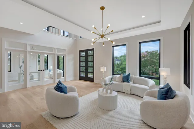 a kitchen with a sink cabinets and a large window