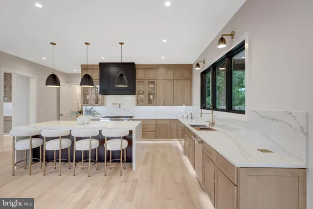 a bathroom with a sink toilet vanity and shower