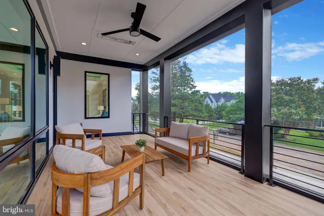 a view of a kitchen with a sink and dishwasher with wooden floors