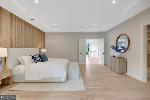 a view of a balcony with wooden floor and outdoor seating