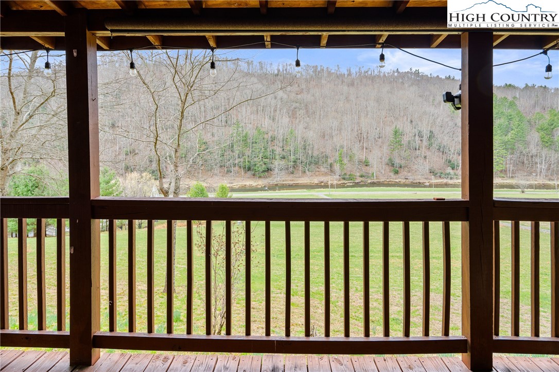 2408 Todd Railroad Grade Road Todd, NC 28684 - Photo 34 of 46 a view of a glass door with a black gate