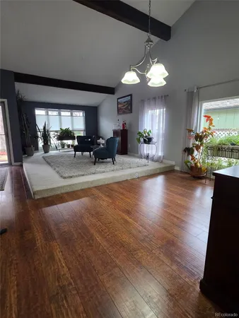 a view of a dining room with furniture window and wooden floor