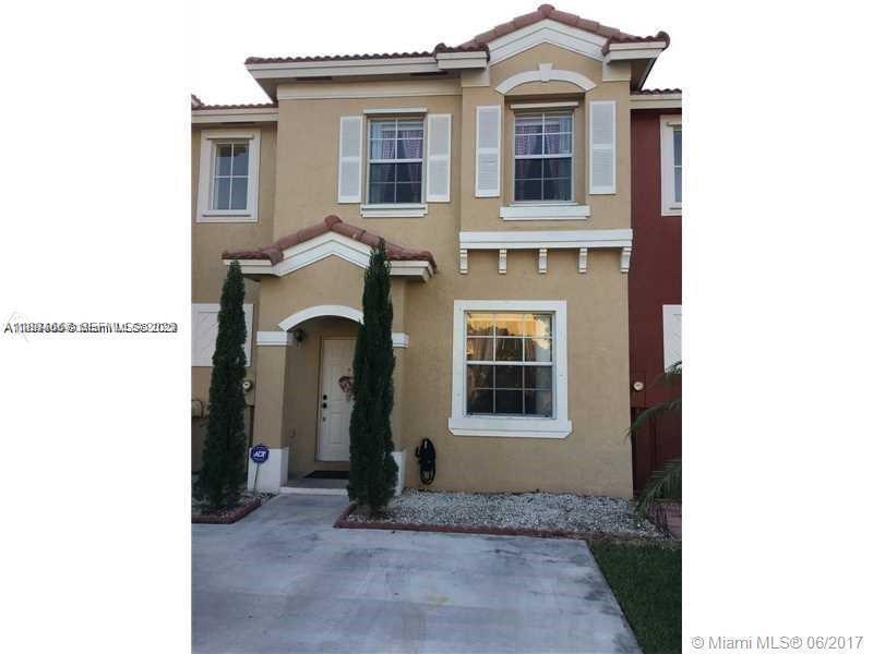 60 Southeast 6th Road Homestead, FL 33030 - Photo 1 of 15 a view of a brick house with large windows