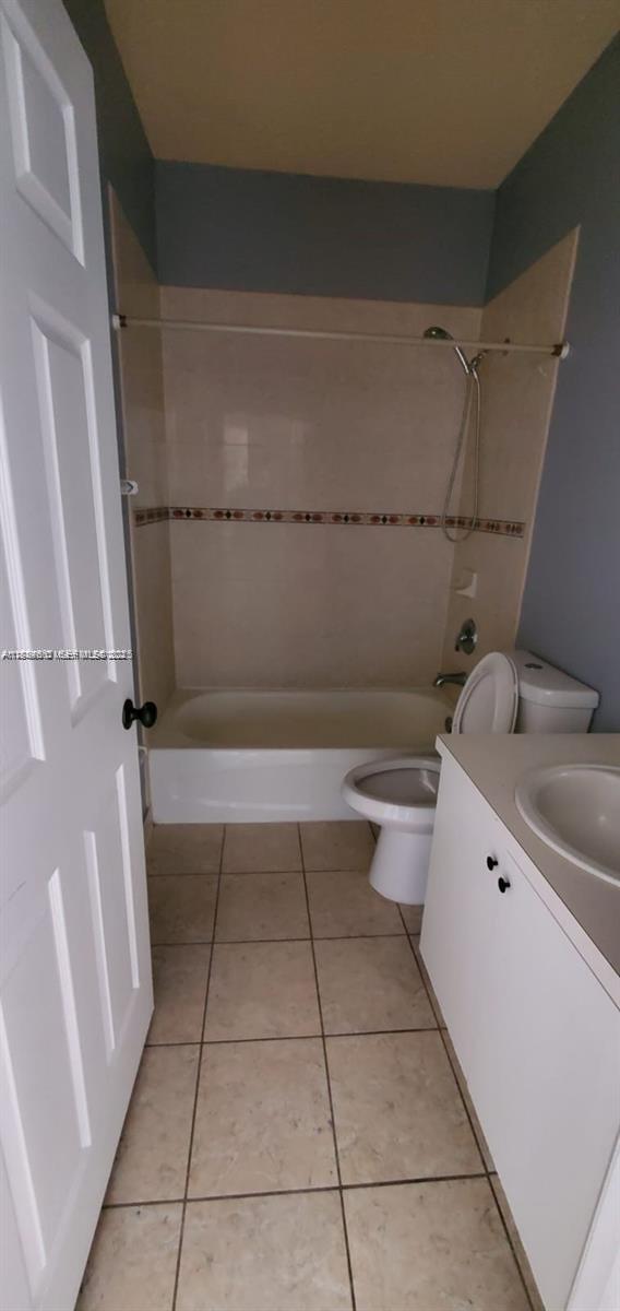 60 Southeast 6th Road Homestead, FL 33030 - Photo 11 of 15 a bathroom with a granite countertop bathtub sink vanity and toilet