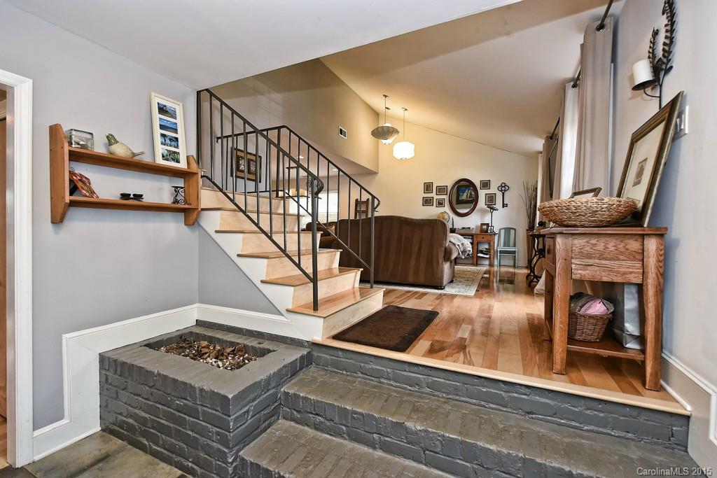 646 Sandridge Road Charlotte, NC 28210 - Photo 2 of 24 a living room with furniture and a fireplace