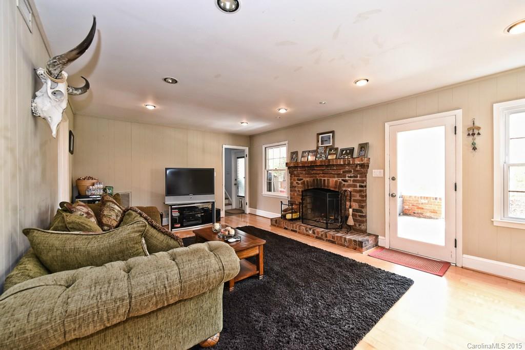 646 Sandridge Road Charlotte, NC 28210 - Photo 11 of 24 a living room with furniture and a fireplace
