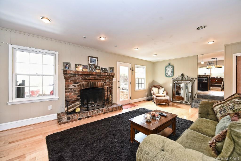 646 Sandridge Road Charlotte, NC 28210 - Photo 12 of 24 a living room with furniture a fireplace and a window