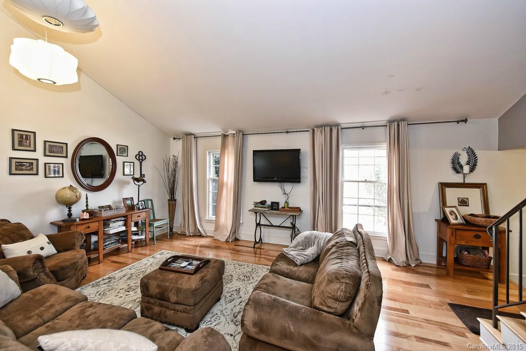 646 Sandridge Road Charlotte, NC 28210 - Photo 3 of 24 a living room with furniture a window and a flat screen tv