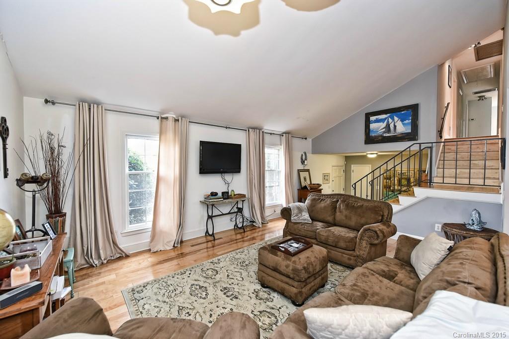 646 Sandridge Road Charlotte, NC 28210 - Photo 4 of 24 a living room with furniture and a flat screen tv