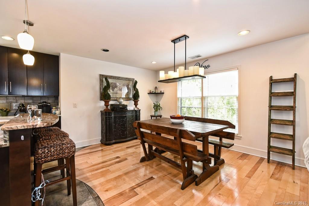 646 Sandridge Road Charlotte, NC 28210 - Photo 6 of 24 a view of a kitchen with dining table and chairs