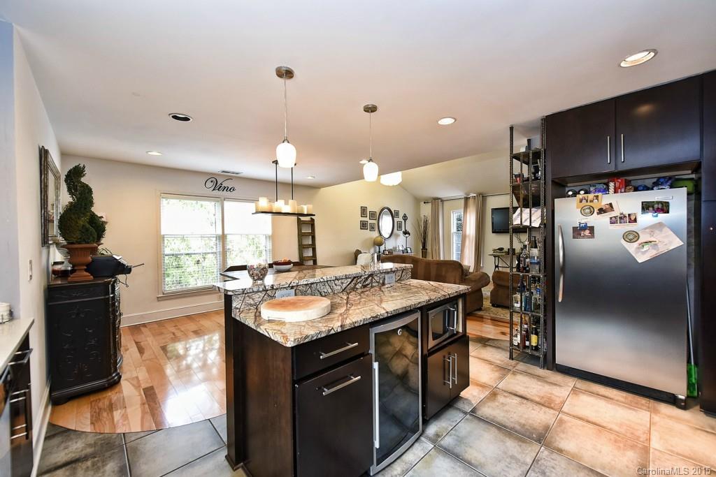 646 Sandridge Road Charlotte, NC 28210 - Photo 10 of 24 a kitchen with stainless steel appliances granite countertop a sink stove and refrigerator