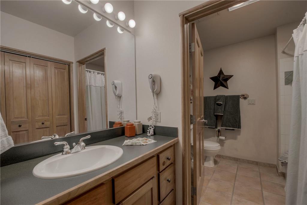129 River Run Road, Unit 8062 Dillon, CO 80435 - Photo 17 of 35 a bathroom with a sink and a mirror