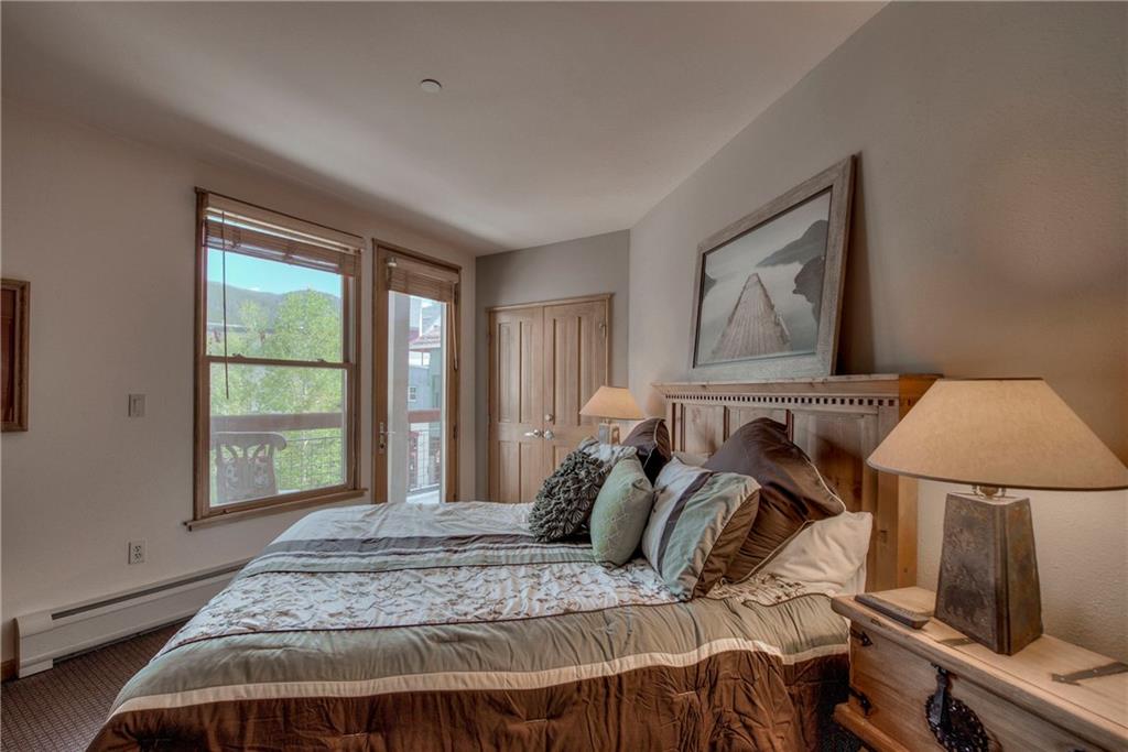 129 River Run Road, Unit 8062 Dillon, CO 80435 - Photo 20 of 35 a bed sitting in a bedroom next to a window