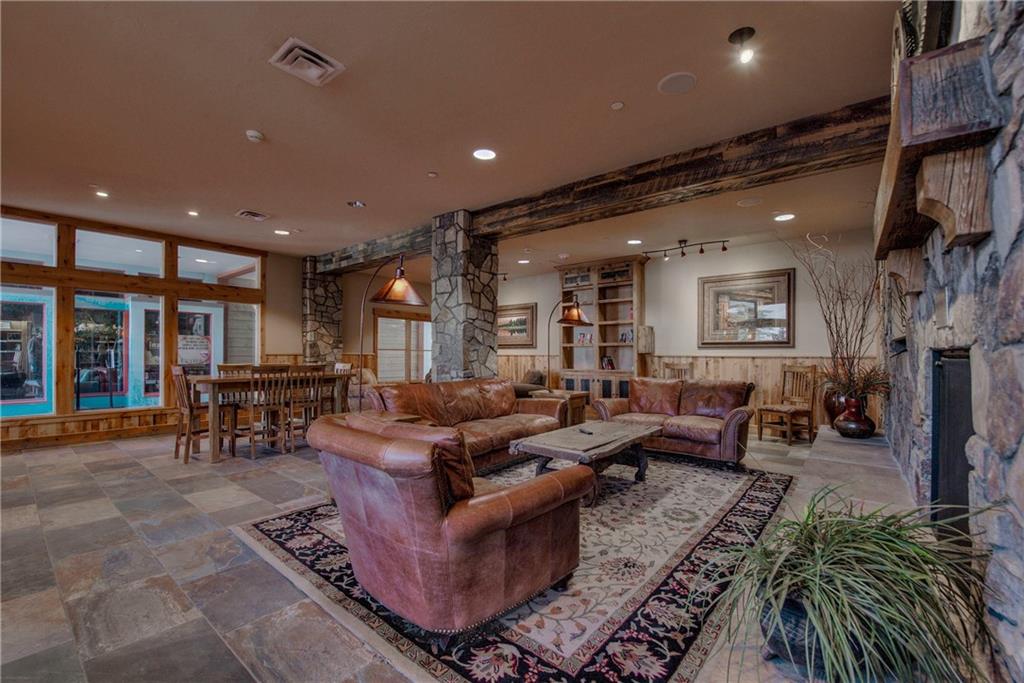 129 River Run Road, Unit 8062 Dillon, CO 80435 - Photo 23 of 35 a living room with furniture and a flat screen tv