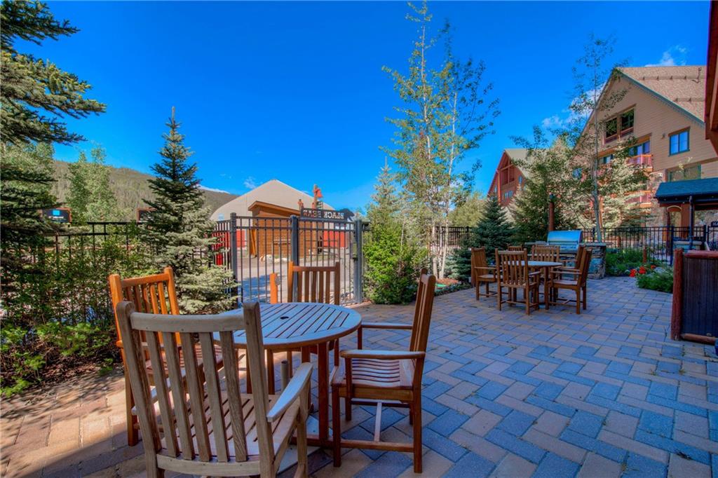 129 River Run Road, Unit 8062 Dillon, CO 80435 - Photo 25 of 35 a view of a patio with a table and chairs
