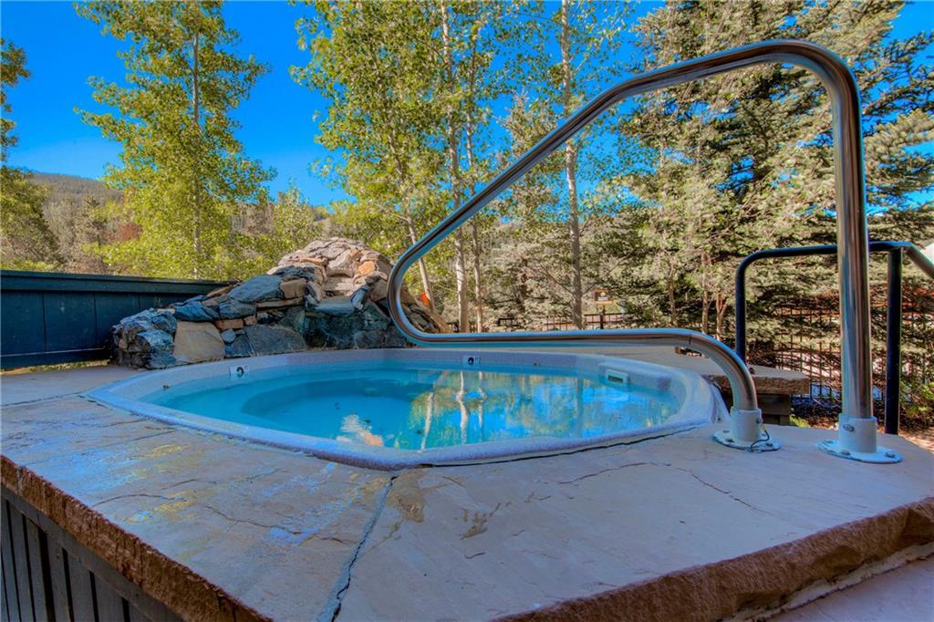 129 River Run Road, Unit 8062 Dillon, CO 80435 - Photo 26 of 35 a view of a swimming pool with a patio and a yard