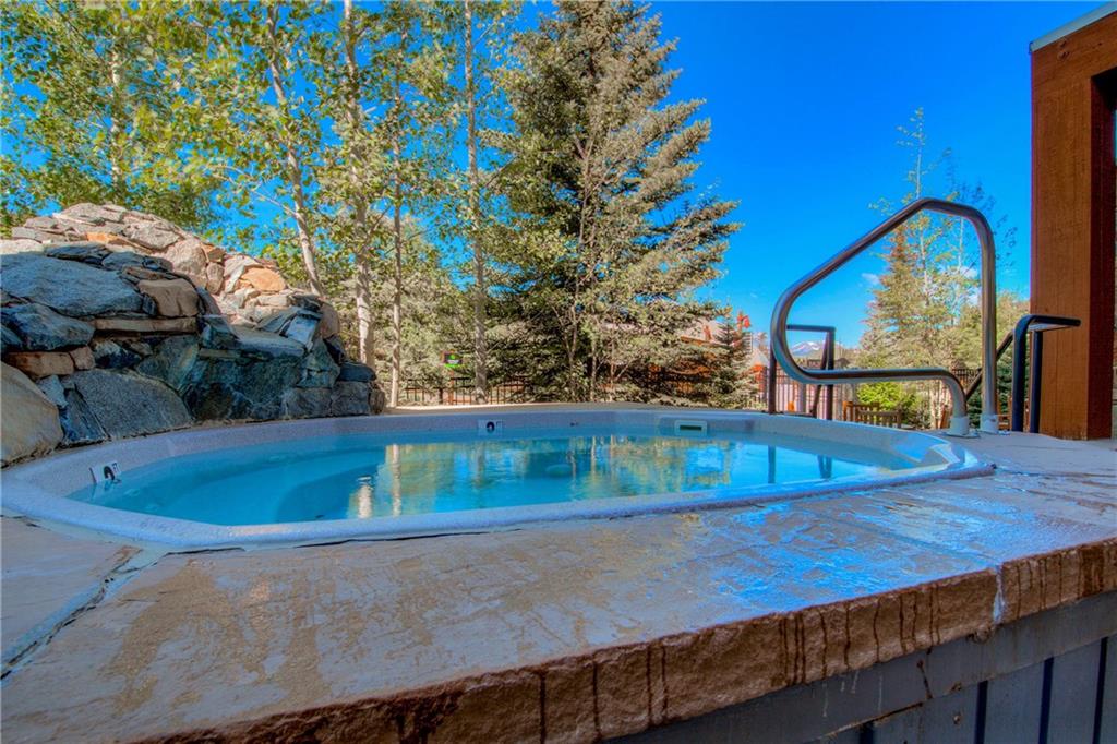 129 River Run Road, Unit 8062 Dillon, CO 80435 - Photo 27 of 35 a view of a swimming pool with a patio