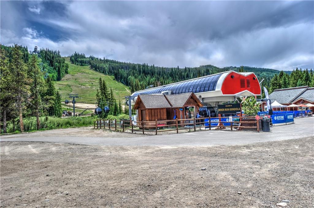 129 River Run Road, Unit 8062 Dillon, CO 80435 - Photo 6 of 35 a view of center with table and chairs under an umbrella