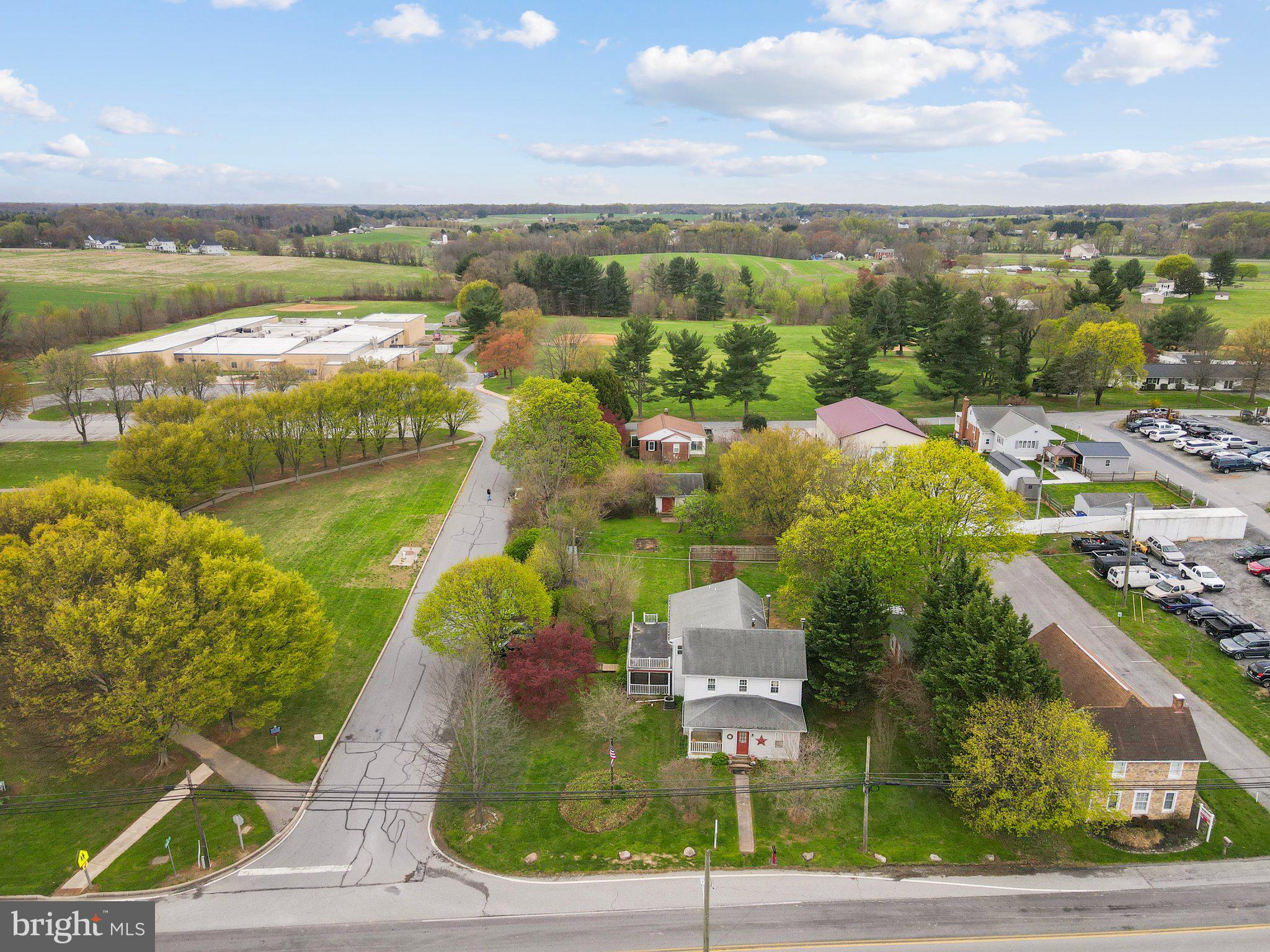 15921 Frederick Road Woodbine, MD 21797 - Photo 33 of 41 Charming neighborhood with lush greenery.