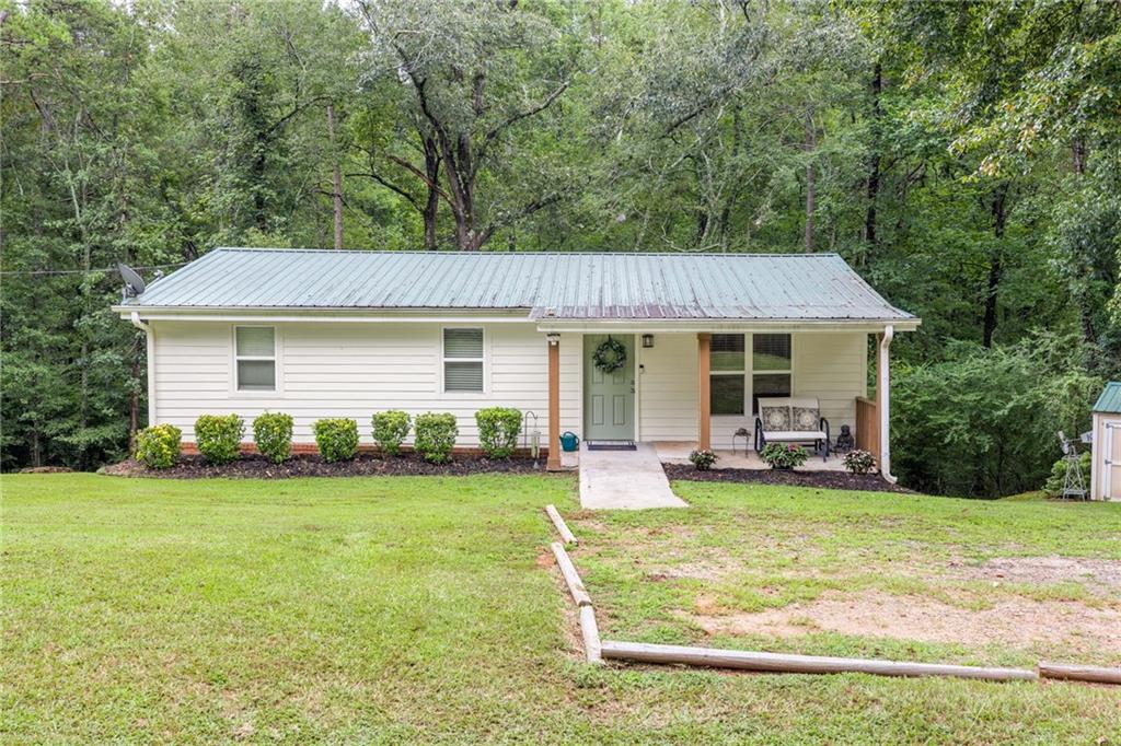 485 Ednaville Road Braselton, GA 30517 - Photo 1 of 1 a view of a house with a yard and sitting area