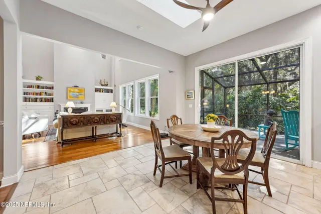 a kitchen with stainless steel appliances a refrigerator sink and microwave