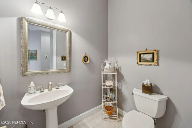 a spacious bedroom with a bed a couch and large window with outer view