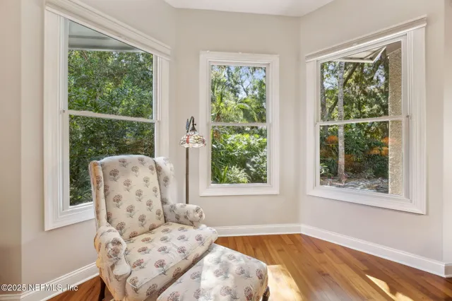 a large bathroom with a double vanity sink a mirror and a bathtub