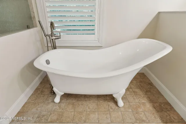 a view of living room with furniture and floor to ceiling window
