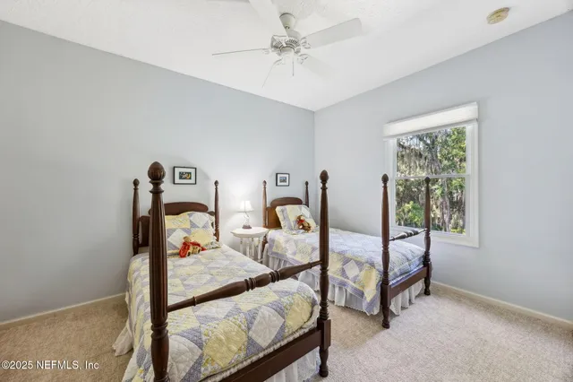 a bathroom with a granite countertop sink toilet a mirror and shower