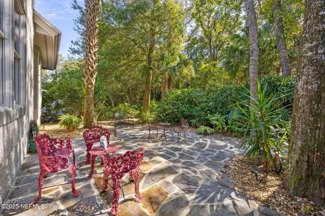 a backyard of a house with lots of green space