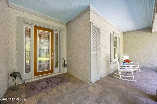 a view of a livingroom with furniture and hardwood floor
