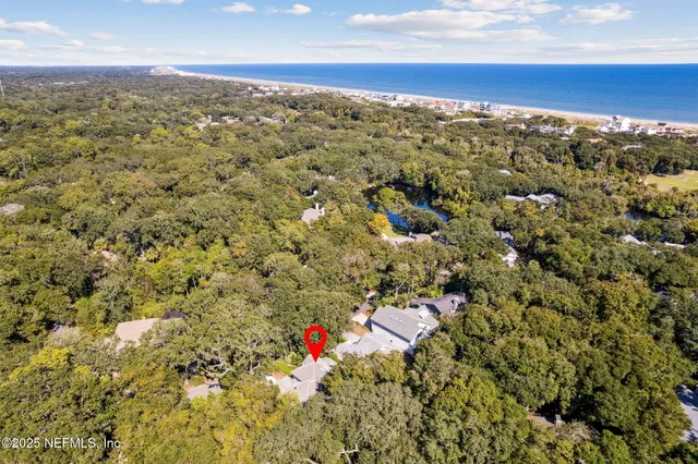 a view of a swimming pool with a patio and a yard
