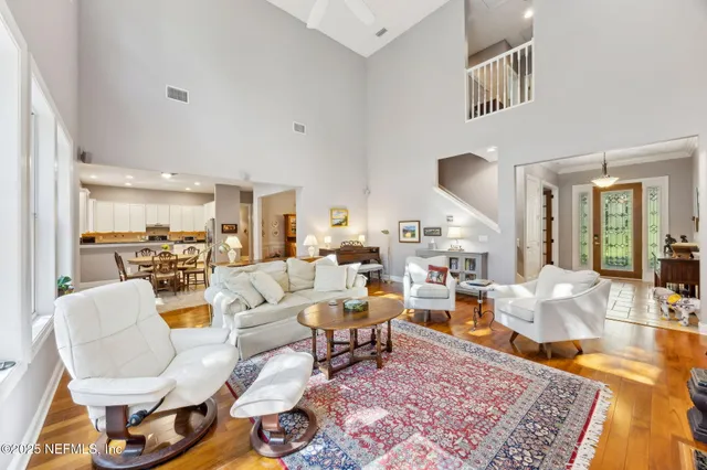 a kitchen with a refrigerator sink and cabinets