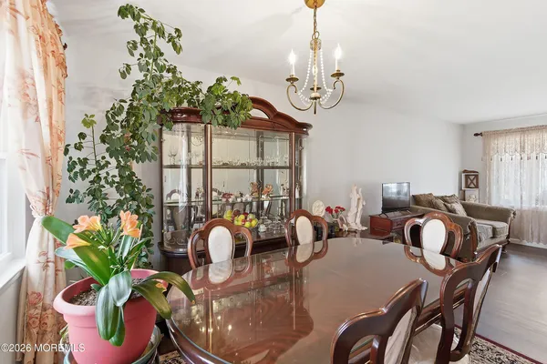 a very nice looking dining room with a table and chairs