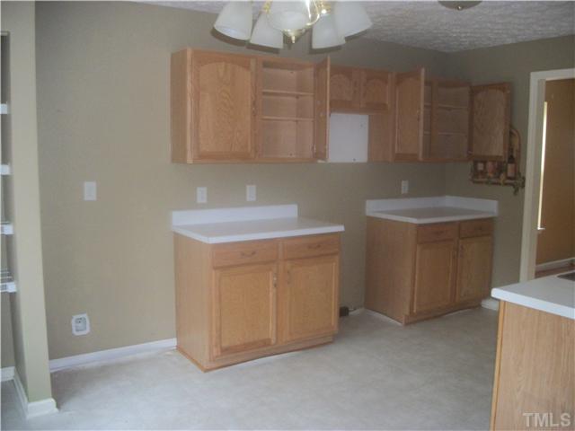 5800 Wynmore Road Raleigh, NC 27610 - Photo 3 of 5 a utility room with cabinets washer and dryer