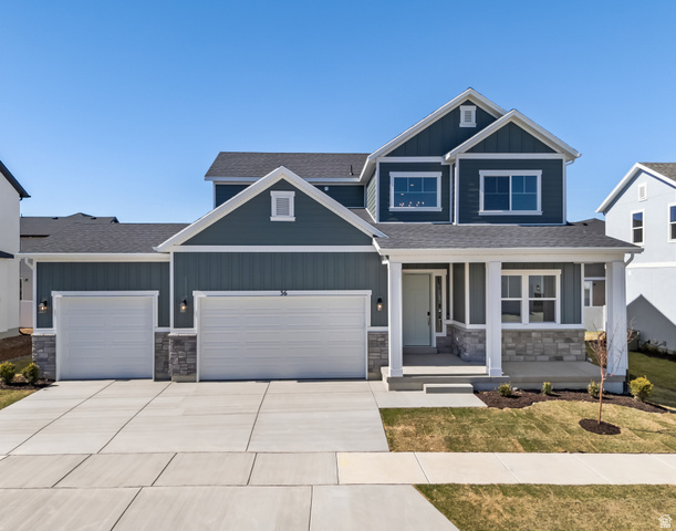 Undisclosed Address Mapleton, UT 84664 - Photo 1 of 1 Contemporary two-story residence featuring a striking blue-gray siding and stone veneer accents
