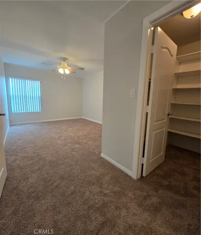 a kitchen with a cabinets and white appliances