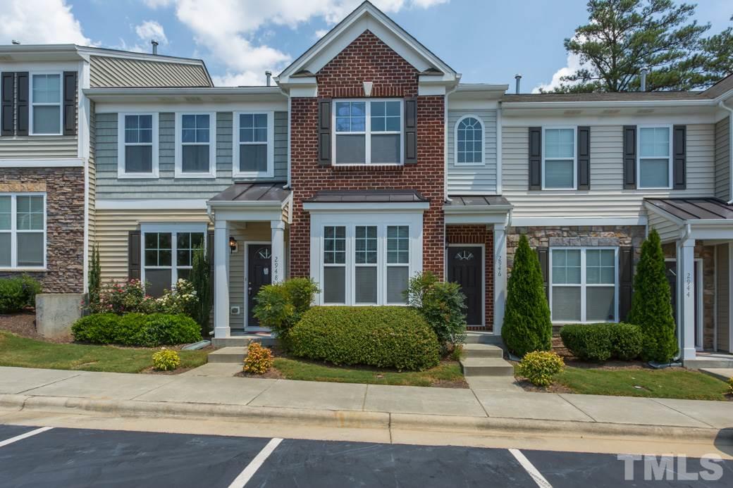 2946 Casona Way Raleigh, NC 27616 - Photo 1 of 25 a front view of a house with a yard and potted plants
