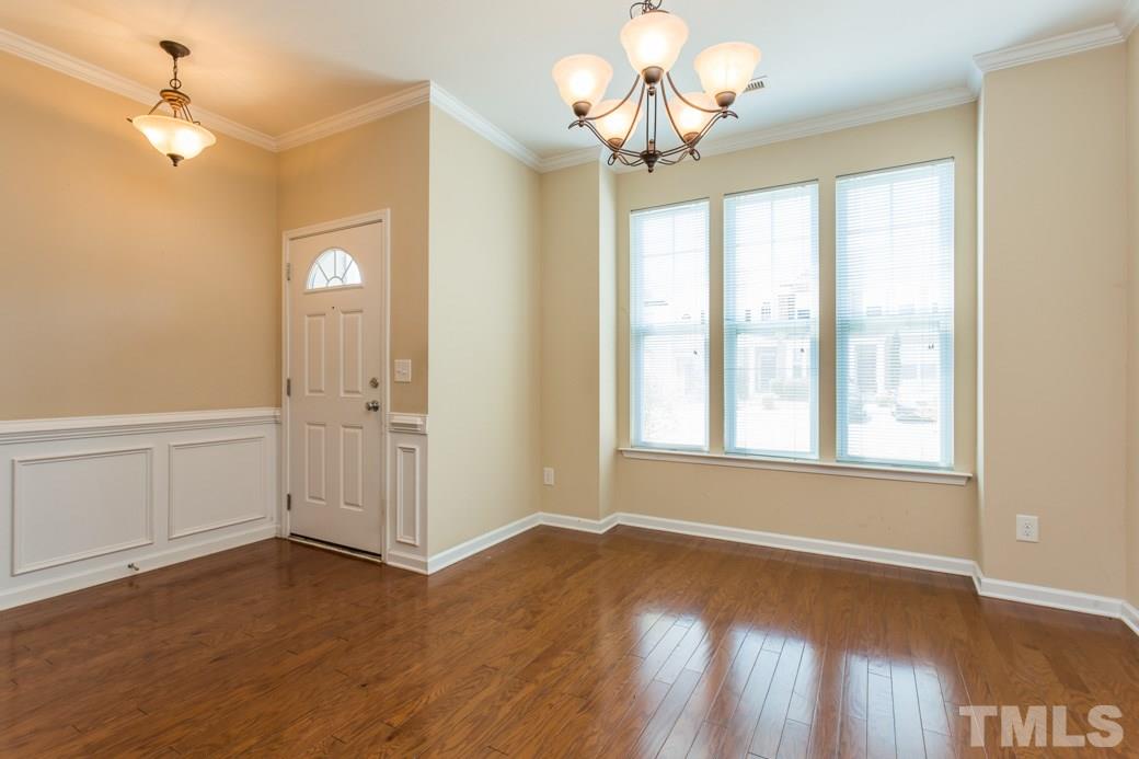 2946 Casona Way Raleigh, NC 27616 - Photo 4 of 25 a view of livingroom with hardwood floor and ceiling fan
