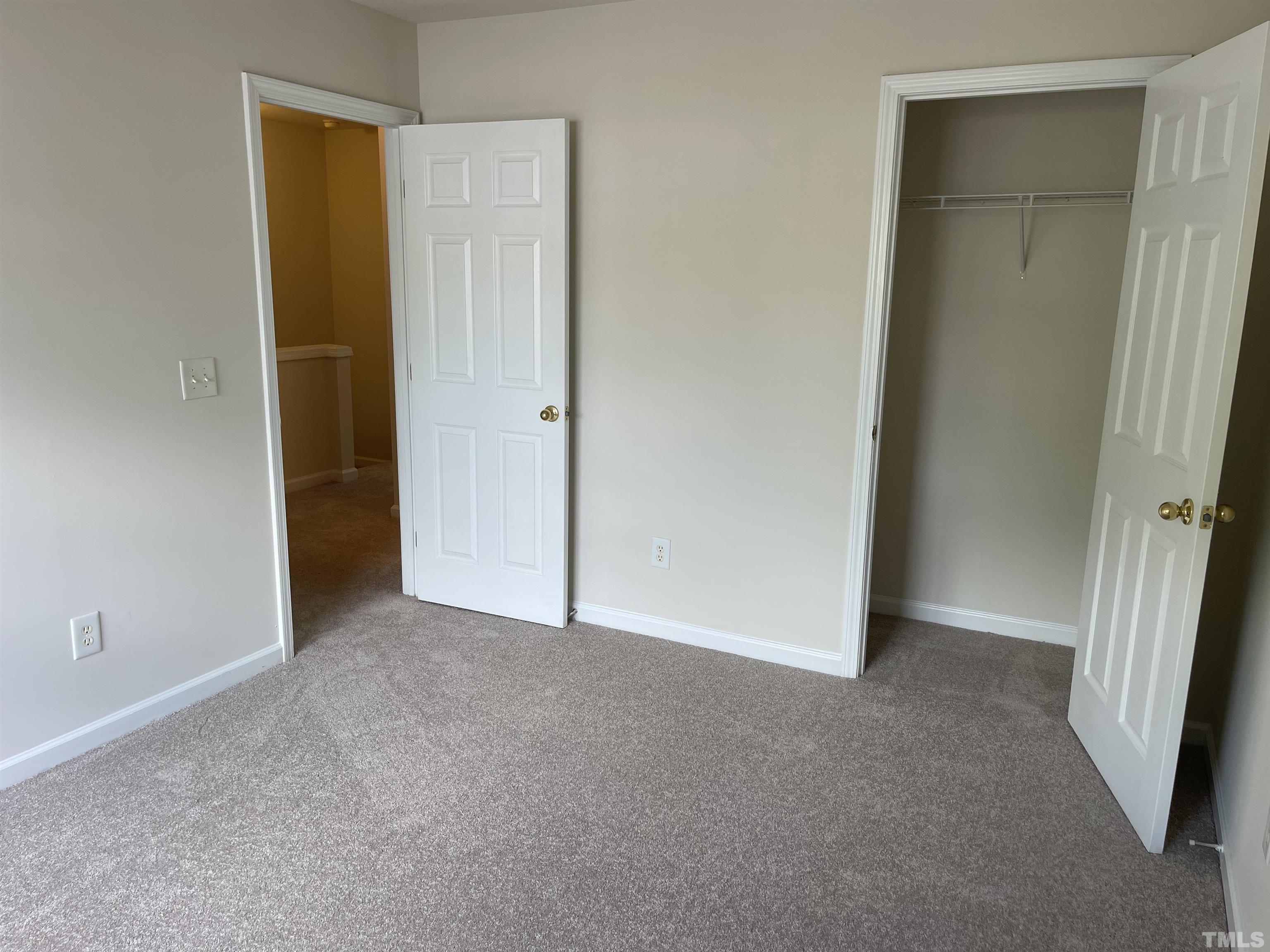 8513 Bright Loop Raleigh, NC 27613 - Photo 23 of 25 a view of an empty room with closet area