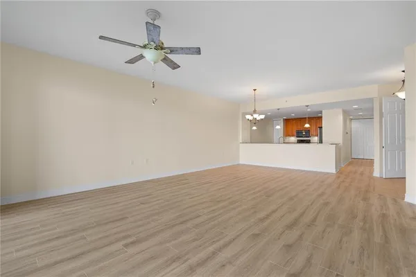 a kitchen with stainless steel appliances kitchen island granite countertop a stove a sink and a refrigerator