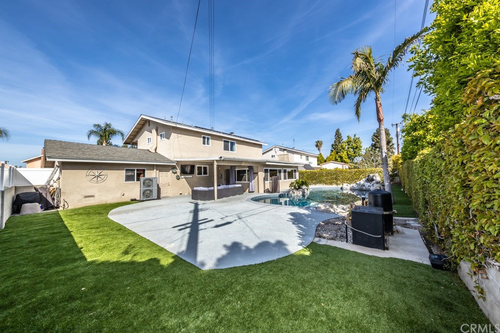 a view of a house with a yard porch and sitting area