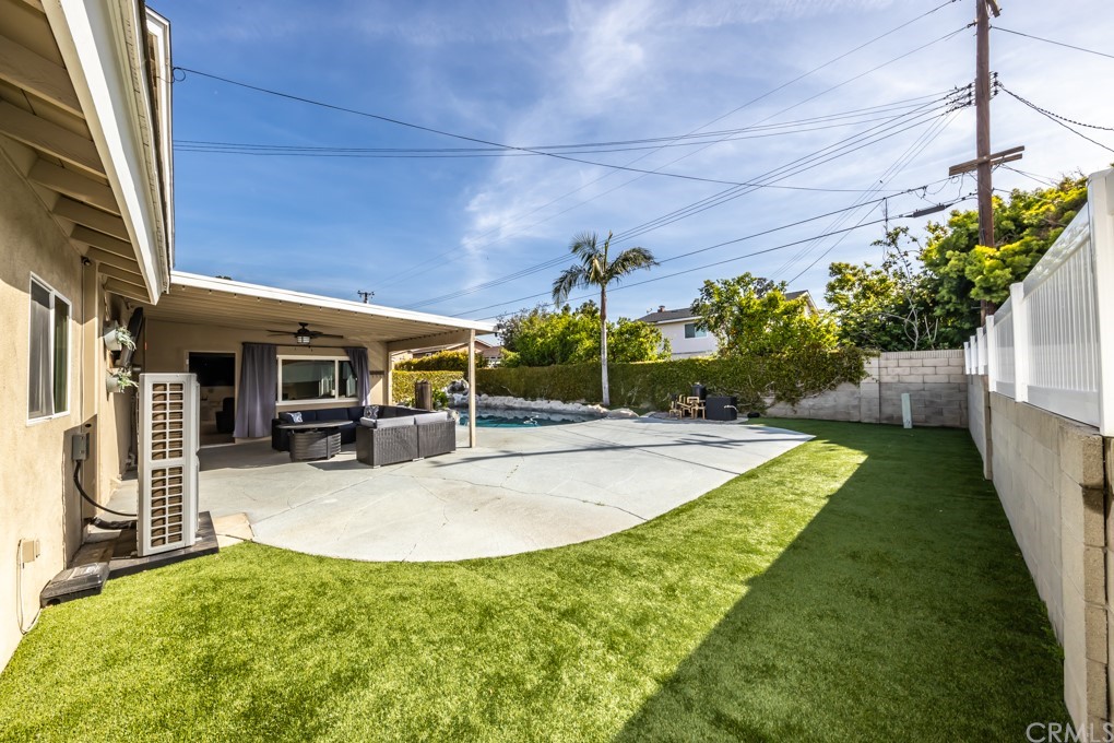 2114 Heloise Way Placentia, CA 92870 - Photo 12 of 61 a view of a backyard with couches plants and large trees