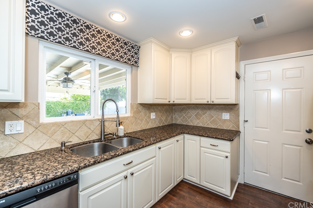 2114 Heloise Way Placentia, CA 92870 - Photo 19 of 61 a kitchen with granite countertop a sink stainless steel appliances and cabinets
