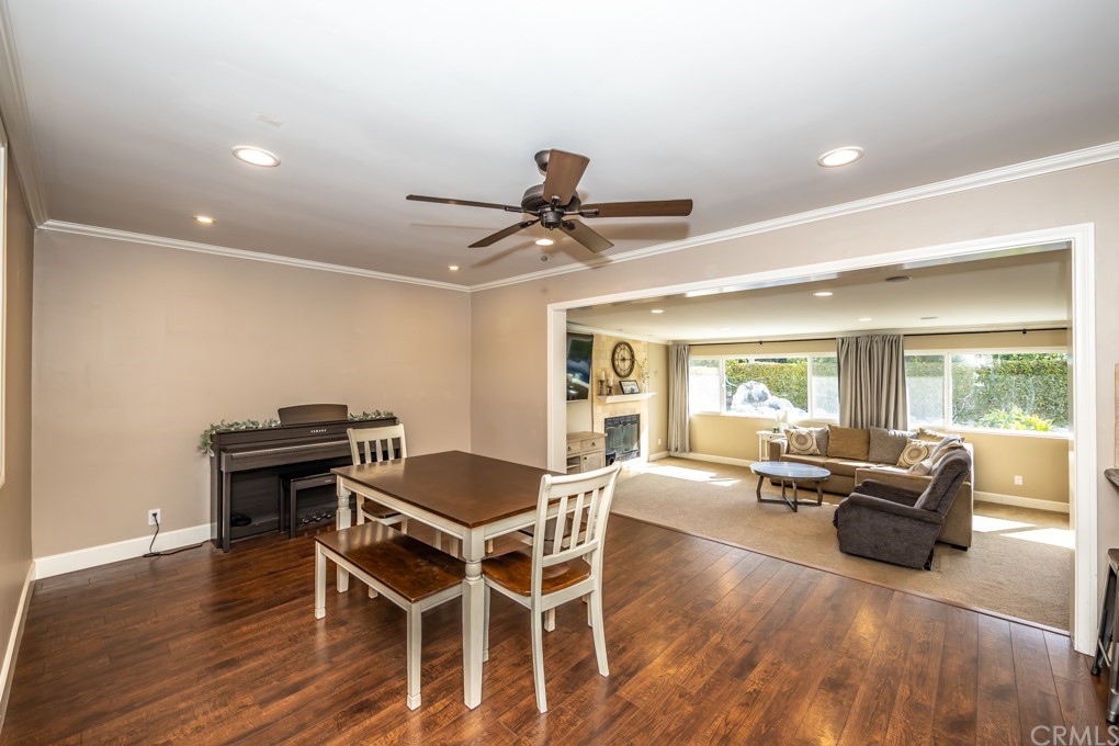 2114 Heloise Way Placentia, CA 92870 - Photo 25 of 61 a living room with furniture a wooden floor and a fireplace