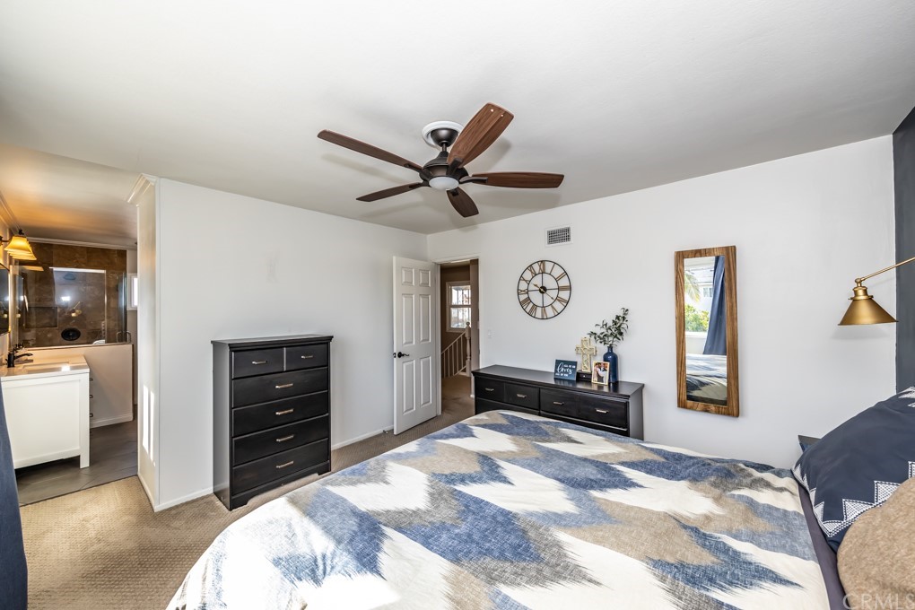 2114 Heloise Way Placentia, CA 92870 - Photo 37 of 61 a bedroom with a bed and a chandelier